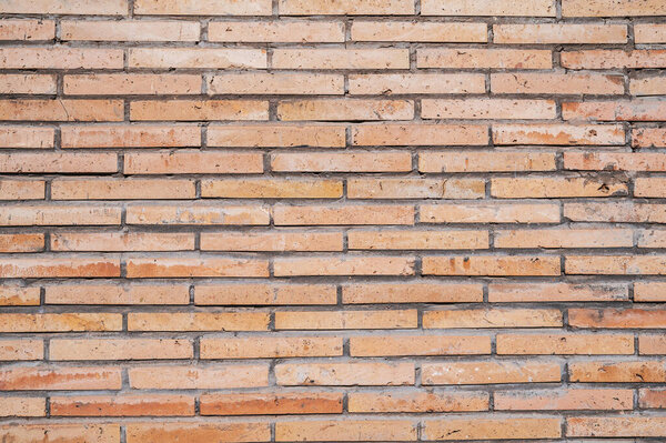 texture of wall of modern light orange decorative bricks