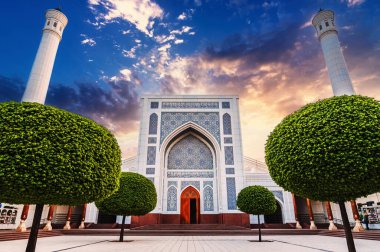 courtyard of modern new Islamic white Minor Mosque with two minarets in Tashkent in Uzbekistan in summer at sunrise clipart