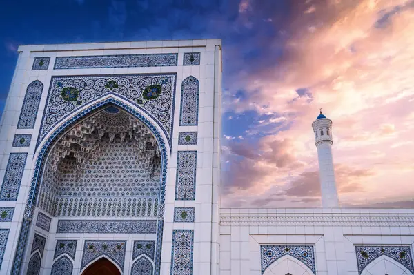 stock image marble wall decorated uzbek ornaments and white minaret of new Islamic Minor Mosque in Tashkent in Uzbekistan on background of the beautiful sky