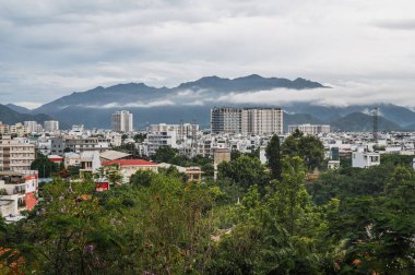 Panoramic view of Nha Trang city from above on a cloudy day in summer. Nha Trang, Vietnam - July 18, 2024 clipart