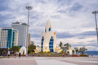 Lotus Tower or Thap Tram Huong Tower on the central square in Nha Trang city on embankment in cloudy weather. Nha Trang, Vietnam - September 6, 2024 clipart