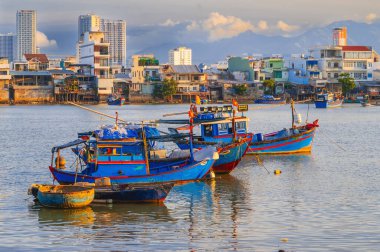 Mooring of traditional Vietnamese fishing boats in the Vietnam river in Nha Trang in Asia. clipart