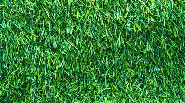 Yapay çimen desenli yeşil arkaplan. Yakın plan.
