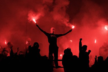 Fans of Benfica firing flares during  Liga Portugal game between FC Porto and SL Benfica at Estadio Do Dragao, Porto, Portugal. (Maciej Rogowski) clipart