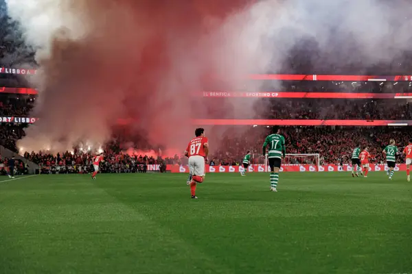 stock image Fans of Benfica using pyrotechnics, Joao Neves, Trincao  during Taca de Portugal second semifinal game between SL Benfica and Sporting CP at Estadio Da Luz, Lisbon, Portugal. (Maciej Rogowski)