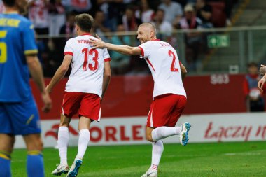 Taras Romanczuk, Polonya ve Ukrayna milli takımları arasında oynanan PGE Narodowy, Varşova, Polonya (Maciej Rogowski) maçında attığı golü kutluyor.)