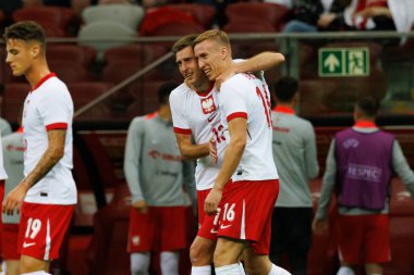 Polonya 'nın oyuncuları, Polonya ve Ukrayna milli takımları arasında oynanan PGE Narodowy, Varşova, Polonya' da oynanan dostluk maçında Taras Romanchuk 'un attığı gol üzerine kutlama yaptılar. 