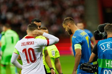Polonya ve Ukrayna milli takımları arasındaki PGE Narodowy, Varşova, Polonya 'da oynanan dostluk maçı sırasında Piotr Zielinski, Andriy Yarmolenko 