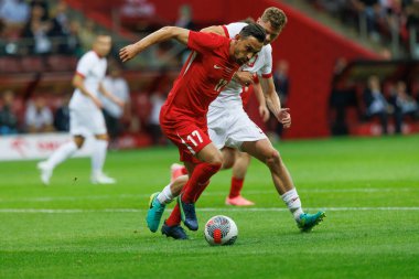 Polonya ve Türkiye milli takımları arasında PGE Narodowy, Varşova, Polonya 'da oynanan dostluk maçı sırasında İrfan Can Kahveci, Pawel Dadowicz (Maciej Rogowski)