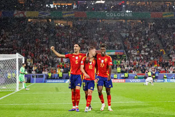 stock image Dani Olmo  seen celebrating after scoring goal with Nico Williams and Mikel Merino during UEFA Euro 2024 Round of 16  game between national teams of Spain and Georgia at RheinEnergieStadion, Cologne, Germany (Maciej Rogowski)