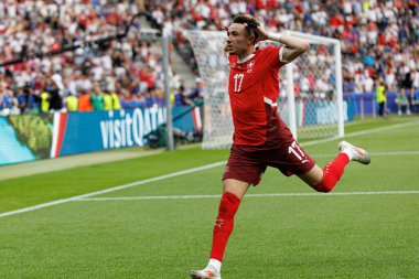 Ruben Vargas, İsviçre ve İtalya milli takımları arasında oynanan 16 maçlık UEFA Euro 2024 raundunda attığı gol sonrasında Olympiastadion, Berlin, Almanya 'da kutlama yaparken görüldü (Maciej Rogowski))