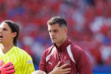 Granit Xhaka, İsviçre ve İtalya milli takımları arasında Almanya 'nın başkenti Berlin' de oynanan 16 maçlık UEFA Euro 2024 turunda görüldü (Maciej Rogowski))