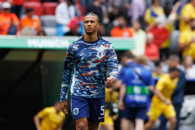 Nathan Ake, Romanya ve Hollanda milli takımları arasında Almanya 'nın başkenti Münih' teki Allianz Arena 'da oynanan 16 maçlık UEFA Euro 2024 turunda görüldü (Maciej Rogowski)