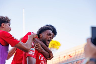 Gustavo Varela seen  celebrating after scoring goal during Liga Portugal 2 game between teams of SL Benfica B and SCU Torreense at Benfica Campus clipart