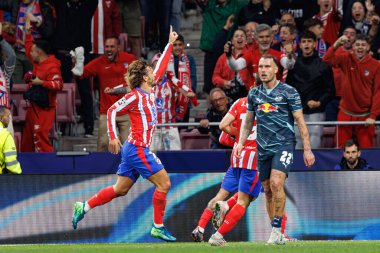 Antoine Griezmann seen celebrating after scoring goal during UEFA Champions League game between teams of Atletico de Madrid and Red Bull Leipzig (Maciej Rogowski) clipart