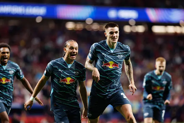 stock image Xavi Simons, Benjamin Sesko seen celebrating after scoring goal during UEFA Champions League game between teams of Atletico de Madrid and Red Bull Leipzig (Maciej Rogowski)