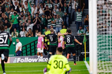 Viktor Gyokeres seen celebrating after scoring goal during UEFA Champions League game between teams of Sporting CP and LOSC Lille (Maciej Rogowski)  clipart