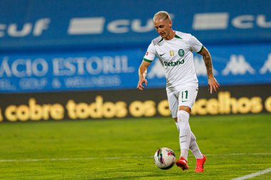 Liga Portekiz maçı sırasında Estoril Praia ile Estadio Antonio Coimbra da Mota 'daki Sporting CP takımları arasında görülen Nuno Santos (Maciej Rogowski)