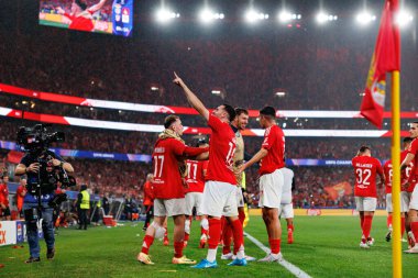 Orkun Kokcu seen celebrating after scoring goal with team during UEFA Champions League game between teams of SL Benfica and Atletico de Madrid  (Maciej Rogowski) clipart