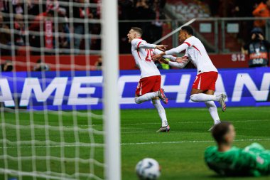 Sebastian Szymanski, PGE Narodowy 'de (Maciej Rogowski) Polonya ve Hırvatistan milli takımları arasında oynanan UEFA Milletler Ligi maçında gol attıktan sonra kutlama yaparken görüldü.)