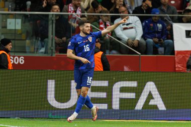 Martin Baturina, Polonya ve Hırvatistan milli takımları arasında PGE Narodowy 'de oynanan UEFA Milletler Ligi maçında gol attıktan sonra kutlama yaparken görüldü (Maciej Rogowski)