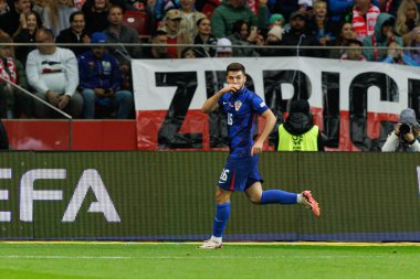 Martin Baturina, Polonya ve Hırvatistan milli takımları arasında PGE Narodowy 'de oynanan UEFA Milletler Ligi maçında gol attıktan sonra kutlama yaparken görüldü (Maciej Rogowski)