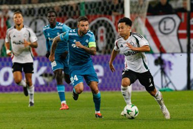 Aitor Ruibal, Ryoya Morishita UEFA Avrupa Konferans Ligi maçında Stadion Miejski Legii Warszawa 'da Legia Warszawa ve Real Betis Balompie takımları arasında görüldü (Maciej Rogowski)