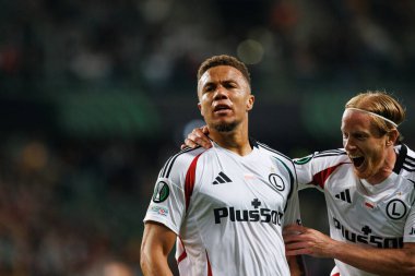 Steven Kapuadi, Radovan Pankov seen celebrating after scoring goal during UEFA Europa Conference League game between teams of  Legia Warszawa and Real Betis Balompie  at Stadion Miejski Legii Warszawa (Maciej Rogowski) clipart