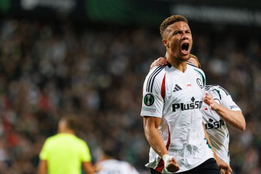 Steven Kapuadi seen celebrating after scoring goal during UEFA Europa Conference League game between teams of  Legia Warszawa and Real Betis Balompie  at Stadion Miejski Legii Warszawa (Maciej Rogowski) clipart