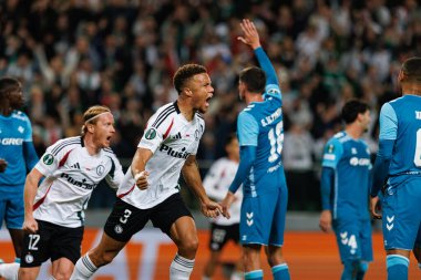 Steven Kapuadi seen celebrating after scoring goal during UEFA Europa Conference League game between teams of  Legia Warszawa and Real Betis Balompie  at Stadion Miejski Legii Warszawa (Maciej Rogowski) clipart