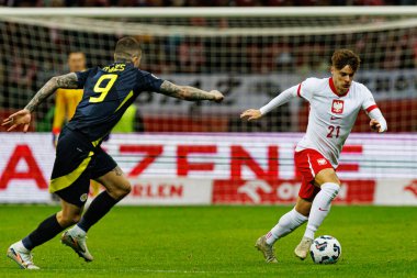 Lyndon Dykes, Nicola Zalewski, Polonya ve İskoçya milli takımları arasında oynanan UEFA Uluslar Ligi maçında PGE Narodowy 'de görüldü (Maciej Rogowski)