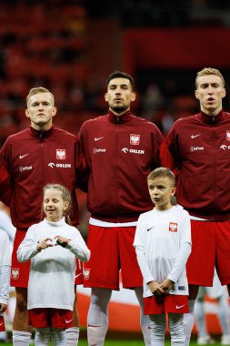 Karol Swiderski, Jakub Moder ve Adam Buksa, Polonya ve İskoçya milli takımları arasında oynanan UEFA Uluslar Ligi maçında PGE Narodowy 'da (Maciej Rogowski)