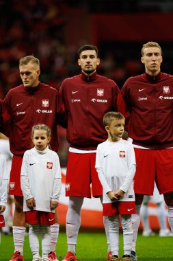 Karol Swiderski, Jakub Moder ve Adam Buksa, Polonya ve İskoçya milli takımları arasında oynanan UEFA Uluslar Ligi maçında PGE Narodowy 'da (Maciej Rogowski)