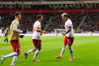 Jakub Moder ve Kamil Piatkowski, Polonya ve İskoçya milli takımları arasındaki UEFA Milletler Ligi maçında gol attıktan sonra PGE Narodowy 'da (Maciej Rogowski)