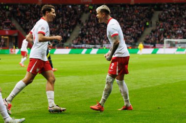 Jakub Moder ve Kamil Piatkowski, Polonya ve İskoçya milli takımları arasındaki UEFA Milletler Ligi maçında gol attıktan sonra PGE Narodowy 'da (Maciej Rogowski)