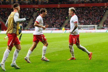 Jakub Moder ve Kamil Piatkowski, Polonya ve İskoçya milli takımları arasındaki UEFA Milletler Ligi maçında gol attıktan sonra PGE Narodowy 'da (Maciej Rogowski)