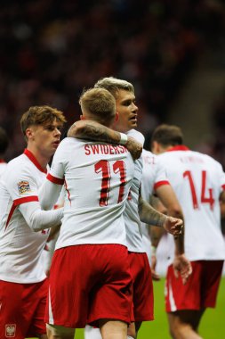 Karol Swiderski ve Kamil Piatkowski, Polonya ve İskoçya milli takımları arasında oynanan UEFA Milletler Ligi maçında gol attıktan sonra PGE Narodowy 'da (Maciej Rogowski)