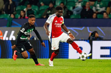 Geny Catamo, Bukayo Saka UEFA Şampiyonlar Ligi maçında Sporting CP ve Arsenal FC takımları arasında görüldü (Maciej Rogowski) 