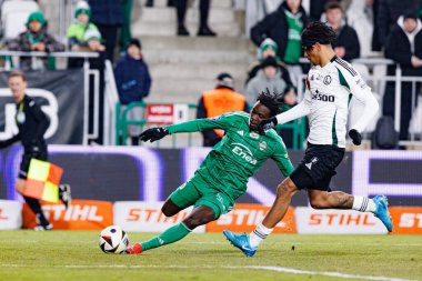 Abdoul Tapsoba ve Maximilian Oyedele, Stadyum 'da Radomiak Radom ve Legia Warszawa takımları arasında oynanan PKO BP Ekstraklasa maçında görüldü. Braci Czachorow (Maciej Rogowski)