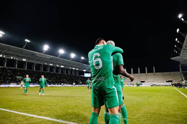 Capita Osvaldo Pedro Capemba, Bruno Jordao ve Abdoul Tapsoba, Stadion Miejski im 'deki Radomiak Radom ve Legia Warszawa takımları arasındaki PKO BP Ekstraklasa maçında gol attıktan sonra kutlama yaparken görüldü. Braci Czachorow (Maciej Rogowski)
