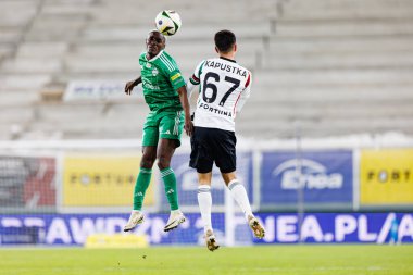 Capita Osvaldo Pedro Capemba ve Bartosz Kapustka, PKO BP Ekstraklasa maçında Radomiak Radom ve Legia Warszawa takımları arasında Stadion Miejski im 'de görüldü. Braci Czachorow (Maciej Rogowski)