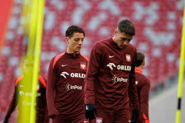 Kacper Urbanski ve Jakub Kiwior, 2025 Mart 'ındaki maçlardan önce Polonya Milli Futbol Takımı' nın üçüncü antrenmanı sırasında görüldü (Maciej Rogowski)