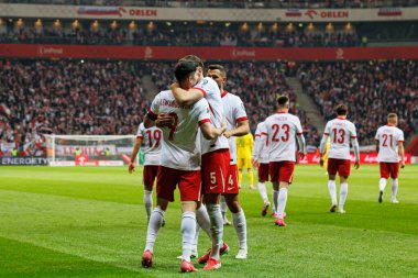 Robert Lewandowski ve Jan Bednarek, PGE Narodowy 'de (Maciej Rogowski) Polonya ve Litvanya milli takımları arasında oynanan 2026 Dünya Kupası ön eleme maçında gol üstüne gol atarken görüldü.)