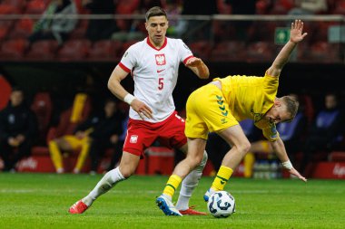 Jan Bednarek ve Domantas Antanavicius, 2026 Dünya Kupası 'nda Polonya ve Litvanya milli takımları arasında PGE Narodowy (Maciej Rogowski)