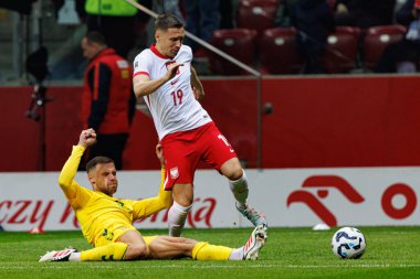 Pijus Syrvys ve Przemyslaw Frankowski, 2026 Dünya Kupası 'nda PGE Narodowy' da Polonya ve Litvanya milli takımları arasında oynanan Avrupa ön eleme maçında görüldü (Maciej Rogowski)