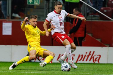 Pijus Syrvys ve Przemyslaw Frankowski, 2026 Dünya Kupası 'nda PGE Narodowy' da Polonya ve Litvanya milli takımları arasında oynanan Avrupa ön eleme maçında görüldü (Maciej Rogowski)