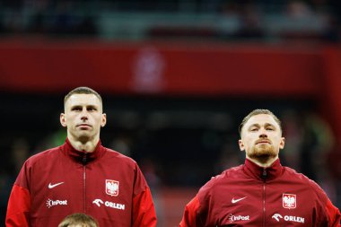 Jakub Piotrowski ve Matty Cash, 2026 Dünya Kupası 'nda Polonya ve Litvanya milli takımları arasında PGE Narodowy (Maciej Rogowski)