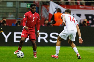 Joseph Mbong ve Jakub Kiwior, 2026 Dünya Kupası eleme maçında Polonya ve Malta milli takımları arasında PGE Narodowy 'da görüldü (Maciej Rogowski)
