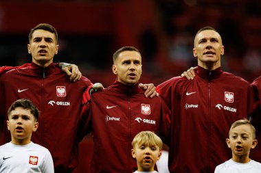 Jakub Kiwior, Przemyslaw Frankowski ve Lukasz Skorupski, 2026 Dünya Kupası eleme maçında Polonya ve Malta milli takımları arasında PGE Narodowy 'da görüldü (Maciej Rogowski)