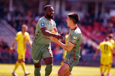 Afimico Pululu ve Joao Moutinho, Korona Kielce ve Jagiellonia Bialystok (Maciej Rogowski) takımları arasındaki PKO BP Ekstraklasa maçında gol attıktan sonra kutlama yaparken görüldü.)